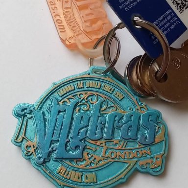 Keychain featuring the word "Vilebras" with decorative elements and associated tags.